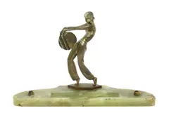 Woman holding a disc, patinated bronze figure on green onyx desk base with two pen holders by Josef Lorenzl, bronze, sold Mar 2018
