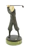 Golfer a patinated bronze and ivory figure on green onyx base signed in the cast Prof Poertzel 23.5cm by Otto Poertzel, bronze and ivory, offered Mar 2018