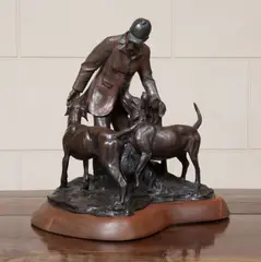 Hunter with three hounds by Veryl Goodnight, patinated bronze with brown patina on a wooden base, sold Dec 2014