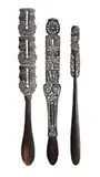 (Milne Bay Province, Papua New Guinea) by Three Massim Spatulas, 1950s, carved wood with fine incised lime-filled traditional decorations, sold Mar 2013