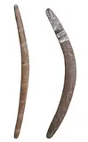 (SOUTH AUSTRALIA and WESTERN AUSTRALIA) by Two Boomerangs, the first of carved wood, of biconvex section, the front decorated with bands of fine pecked lines, the back with small, sold Apr 2012