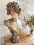 Buste de femme à la couronne de fraises by Friedrich Goldscheider, vers 1900, Terre cuite patiné, sold Apr 2023