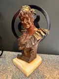 Buste de jeune femme au bandeau by Van der Straeten, Bronze à patine mordorée, sold Oct 2024