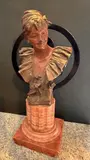 Buste de jeune femme au bandeau sur un socle en pierre dure by Van der Straeten, Bronze à patine mordorée, sold Oct 2024