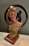 Buste de jeune femme au chignon by Van der Straeten, Bronze à patine mordorée, sold Oct 2024