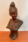 Buste de jeune femme au chignon banane by Van der Straeten, Bronze à patine chocolat, sold Oct 2024