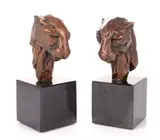 Untitled by Michael Canadas, bronze Leopard head bookends, sold Dec 2023