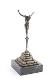 bronze "Christ de Saint Jean de la Croix" depicting Christ on the cross standing on a Roman nail held by stacked stones by Salvador Dalí, marble base, sold Apr 2023
