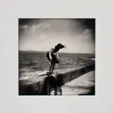 Girl Jumping off Sea Wall by Brigitte Grignet, 2006, Gelatin Silver Print, sold Oct 2024