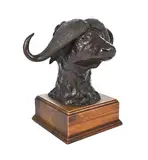 Buffalo head by Donald Greig, bronze mounted on a wooden base, sold Sep 2024
