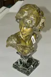 a bronze bust of a figure looking over their right shoulder by Jean Antoine Injalbert, bronze, sold Apr 2019