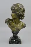 a bronze bust of a figure looking over their right shoulder by Jean Antoine Injalbert, bronze, sold Mar 2019