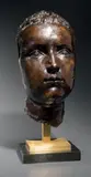 Visage de jeune homme by Jules Dalou, Epreuve en bronze à patine brune richement nuancée, sold Nov 2016