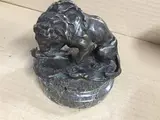 Lion attaquant un serpent by Louis-Albert Carvin, Bronze patiné signé en creux sur la terrasse et reposant sur une base circulaire en marbe, sold Sep 2018
