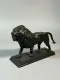 Lion marchant by Antoine-Louis Barye, Bronze à patine verte signé sur la terrasse, sold Apr 2025