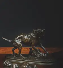 Chien jouant avec une balle by Arthur Waagen, Épreuve en bronze à patine brune, sold Dec 2024
