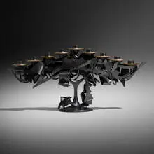Menorah by Albert Paley, 2013, forged mild steel with a blackened patina, removable brass bobeches, sold Oct 2022