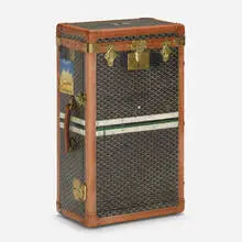 Valet case by Goyard, c. 1920, vinylized canvas, leather, brass, wood, sold Oct 2022