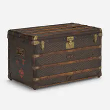 Steamer trunk by Goyard, c. 1920, vinylized canvas, brass, leather, wood, sold Oct 2022