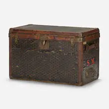 Steamer trunk by Goyard, c. 1920, vinylized canvas, leather, brass, sold Oct 2022