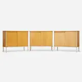 Cabinets set of three by Jean Prouvé, c. 1950, mahogany veneer, enameled metal, aluminum, sold Oct 2022
