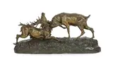 A bronzed group of rutting stags, standing upon a naturalistic base by Thomas François Cartier, bronze, sold Jun 2022
