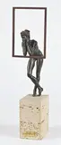 Femme nue accoudée sur un cadre by Josep Bofill, Bronze à patine brune noire, reposant sur un socle en pierre, sold Dec 2019