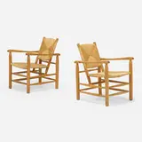 Armchairs, pair by Charlotte Perriand, c. 1947, ash, rush, sold Oct 2022