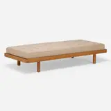 Daybed from the Fondation Franco-Bresilienne, Cité Internationale Universitaire de Paris by Charlotte Perriand, 1956-1959, oak, upholstery, sold Oct 2022