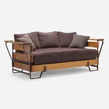 Daybed by Jacques Adnet, c. 1955, saddle-stitched leather over steel, elm, upholstery, sold Oct 2022