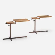 Adjustable occasional tables, pair by Georg Albert Ulysse Caruelle, 1942, walnut, bronzed steel, Bakelite, sold Oct 2022