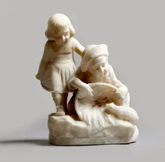 An early 20th century carved alabaster group of a boy and a girl, holding a basket and playing with a cat, the naturalistic base signed 'G by Giuseppe Gambogi, sculpture, offered Jul 2017