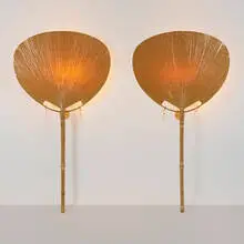 Uchiwa floor lamps, pair by Ingo Maurer, c. 1975, bamboo, lacquered paper, rawhide, enameled steel, sold Oct 2022