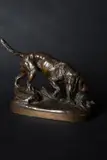 A patinated bronze model of a spaniel chasing a bird by Prosper Lecourtier, bronze, offered Dec 2020