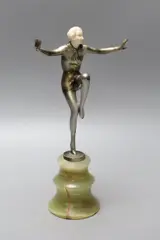 Cold painted bronze and ivory figure of a female dancer, raised on an onyx stand by Josef Lorenzl, bronze and ivory, sold Apr 2022