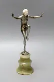 Cold painted bronze and ivory figure of a female dancer, raised on an onyx stand by Josef Lorenzl, bronze and ivory, sold Apr 2022