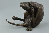 a bronze sculpture of a dog sitting down and scratching his face, height approximately 10cm by Paul Jenkins, bronze, sold May 2018