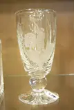 a celery vase with etched detail of huntsman, signed and dated 1987 under by David Whyman Glass, 1987, etching, sold Apr 2018