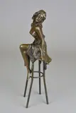 a contemporary bronze sculpture of a scantily clad female sitting on a stool, by Pierre Collinet, bronze, sold Apr 2018