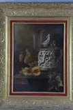 Still life study of a stoneware and metal tankard with moulded decoration, an ale glass, fruiting vine and peach on a table by Andreas Gyula Bubarnik, oil on panel, sold Mar 2018