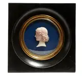A wax portrait relief bust of a young lady, in an ebonised frame, the verso with a printed paper label inscribed 'Gio by Giovanni Antonio Santarelli, sculpture, sold Apr 2017