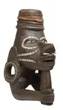 A Canoe Prau Ornament Nguzu Nguzu by Oceanic Artefacts, finely carved in the form of a human face, carved pieces of pearl shell inlaid for eyes, and in patterns surrounding the, sold Oct 2009