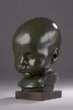 Portrait d'enfant (Louise Schnegg ?) by Lucien Schnegg, Bronze patiné, sold Dec 2021