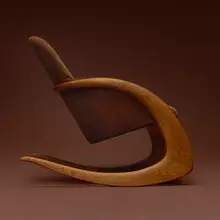 Crescent rocker by Wendell Castle, 1974, oak, suede upholstery, sold Jul 2026