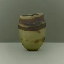 Olive asymmetric pot, dark halos by Jennifer Lee, 1985, hand-built colored stoneware with oxides, sold Jul 2026