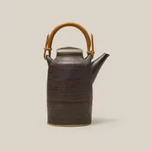 Teapot by Lucie Rie, c. 1960, glazed stoneware, bamboo, sold Jul 2026