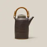 Teapot by Lucie Rie, c. 1960, glazed stoneware, bamboo, sold Jul 2026