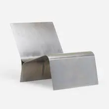 Lounge chair, model 933 by Maria Pergay, c. 1975, stainless steel, sold Oct 2022