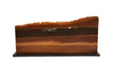 A wooden sculpture by Pina Pedano, sculpture, offered Oct 2022
