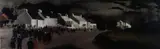 Print - row of whitewashed cottages and congregation by John Knapp-Fisher limited edition, print, sold Mar 2019